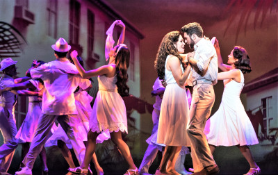 Gloria (Christie Prades) and Emilio Estefan (Mauricio Martinez) dance close in On Your Feet! at the Cadillac Theatre.