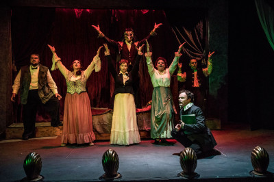 (front right) Kevin Webb with (back, l to r) Matt McNabb, Maiko Terazawa, Megan DeLay, Ryan Lanning, Jessica Lauren Fisher and Jeremy Trager in Black Button Eyes Productions’ Chicago premiere musical NEVERMORE – The Imaginary Life and Mysterious Death of Edgar Allan Poe