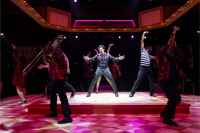 TYler Hanes (center) as Elvis Presley in Heartbreak Hotel at Marriott Theatre.